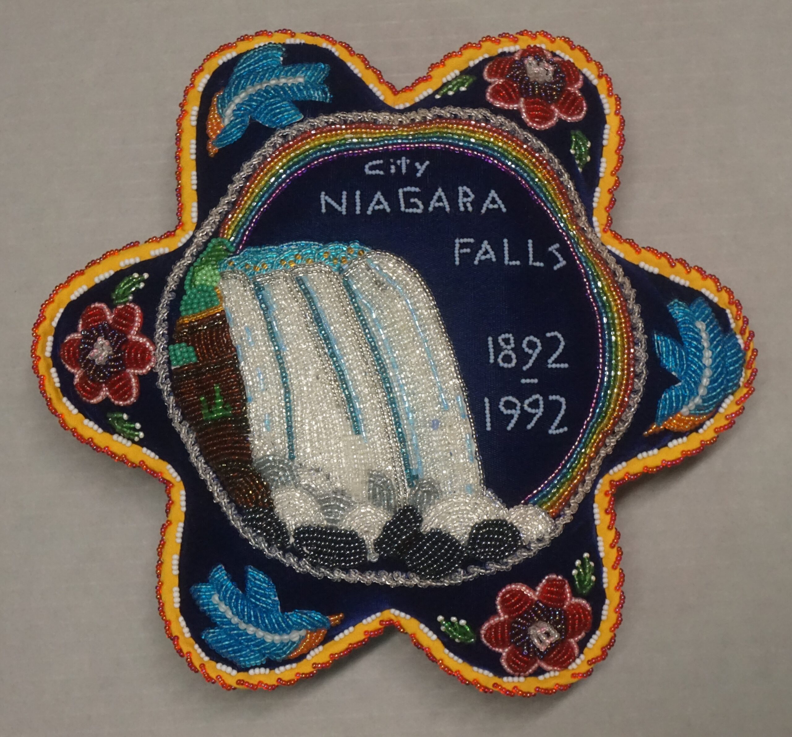 Detail image of a Niagara Falls Pincushion made by Marlene Printup, featured in the exhibition.