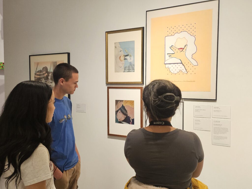 Students looking a a drawing on the wall