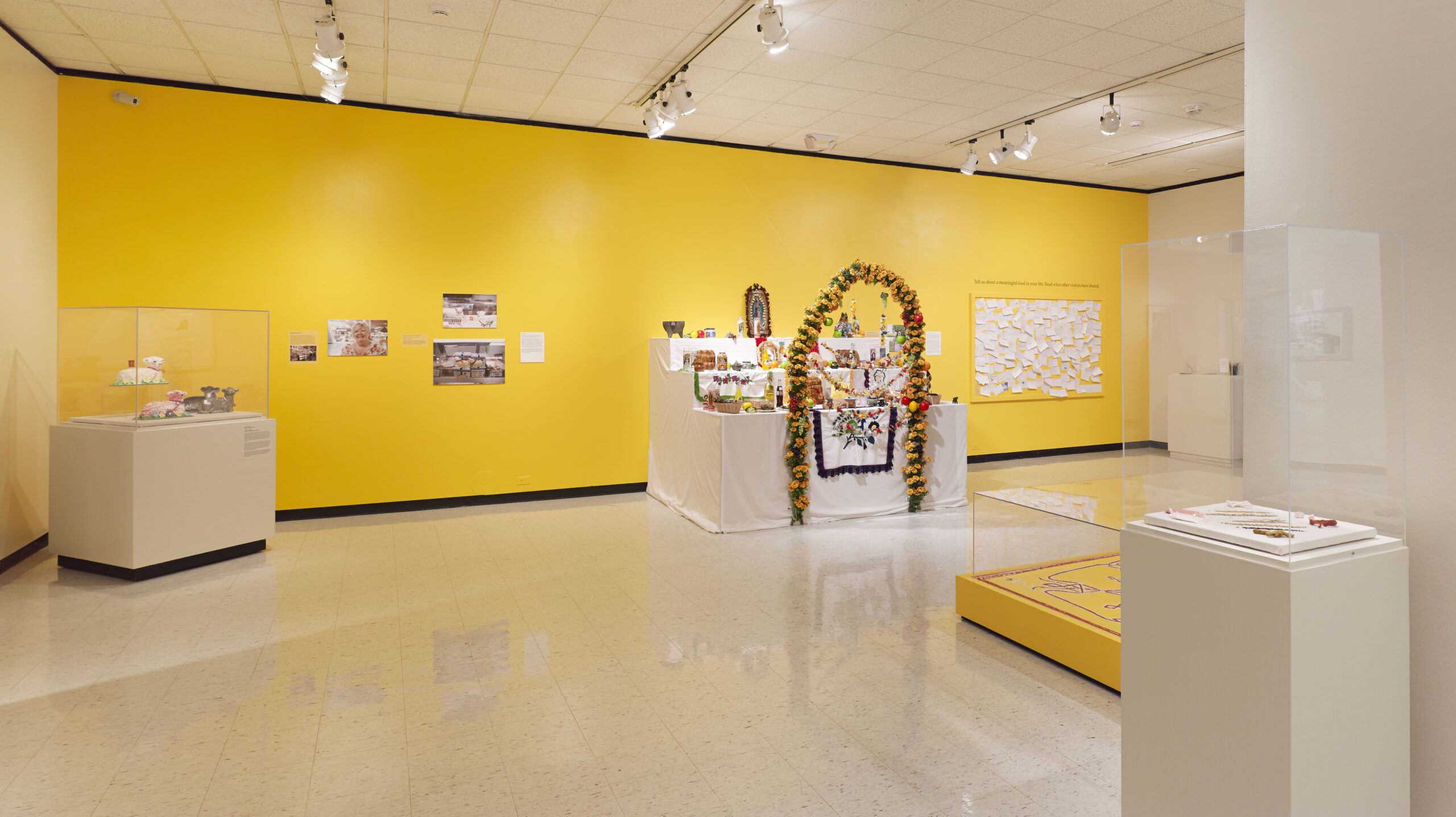 (Almost) Too Good to Eat installation photo showing butter lambs, an ofrenda, and a Bhutanese Nepali rangoli altar, 2013